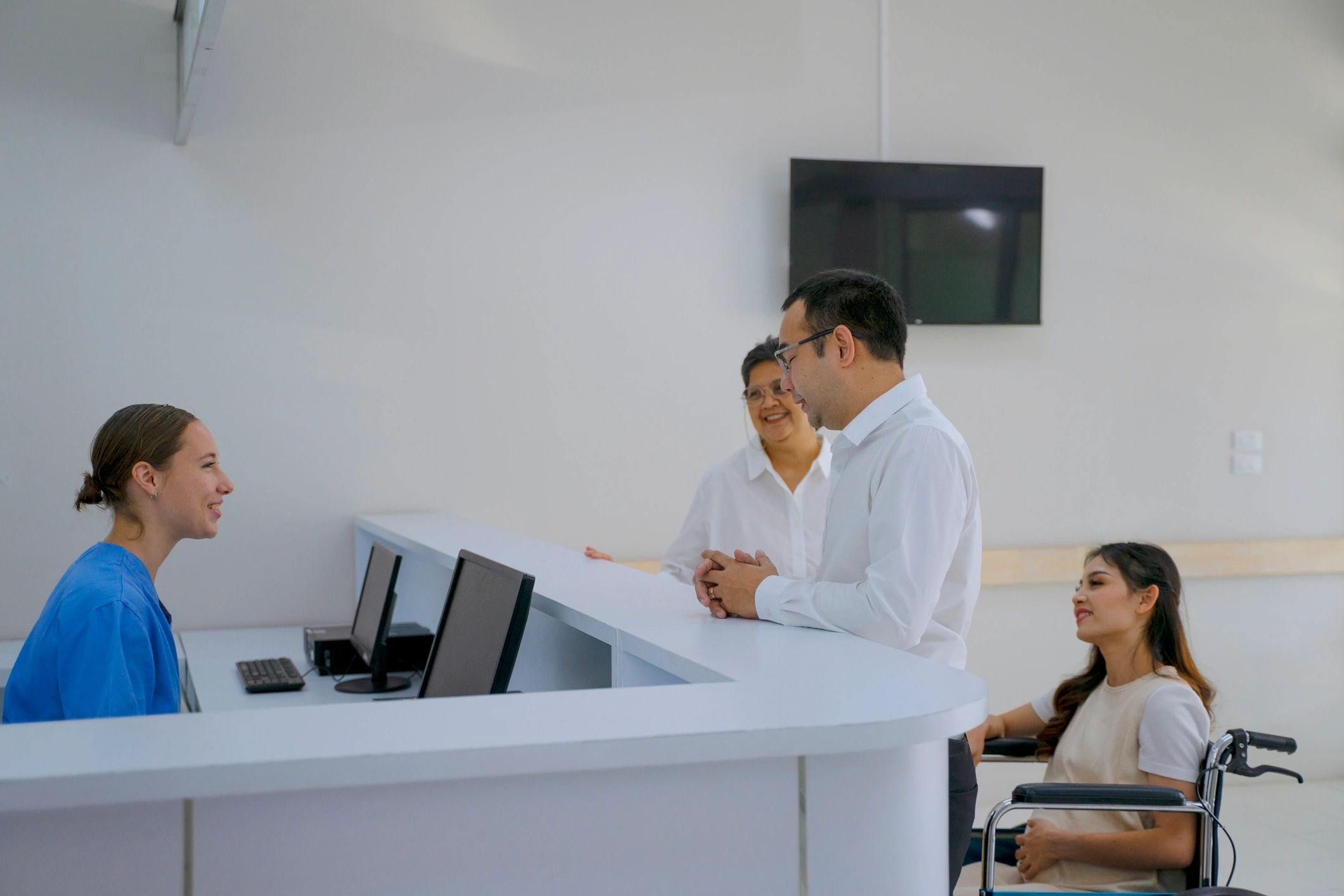 Family arriving at hospital reception