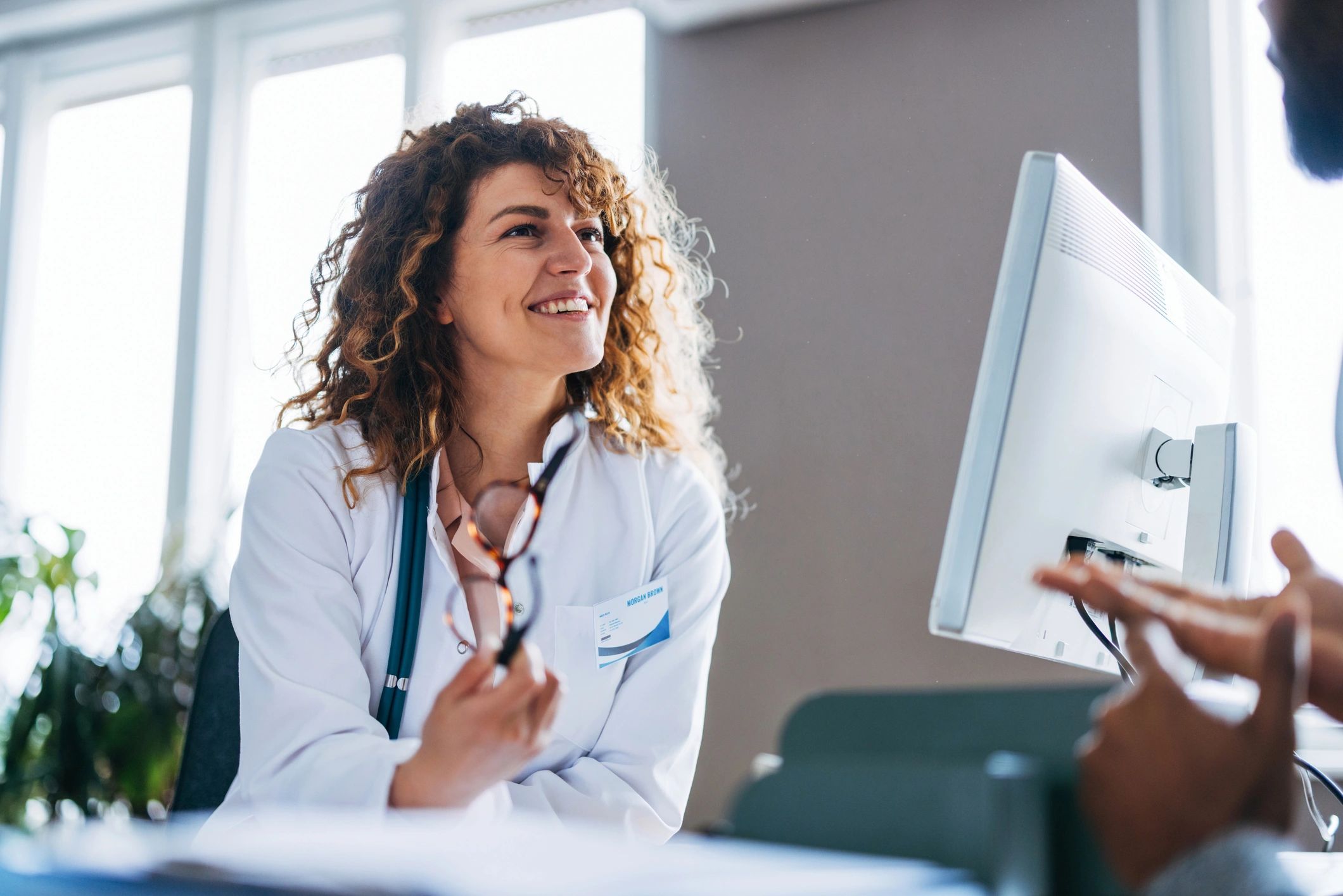 Ocean Health Care team member speaking with a patient