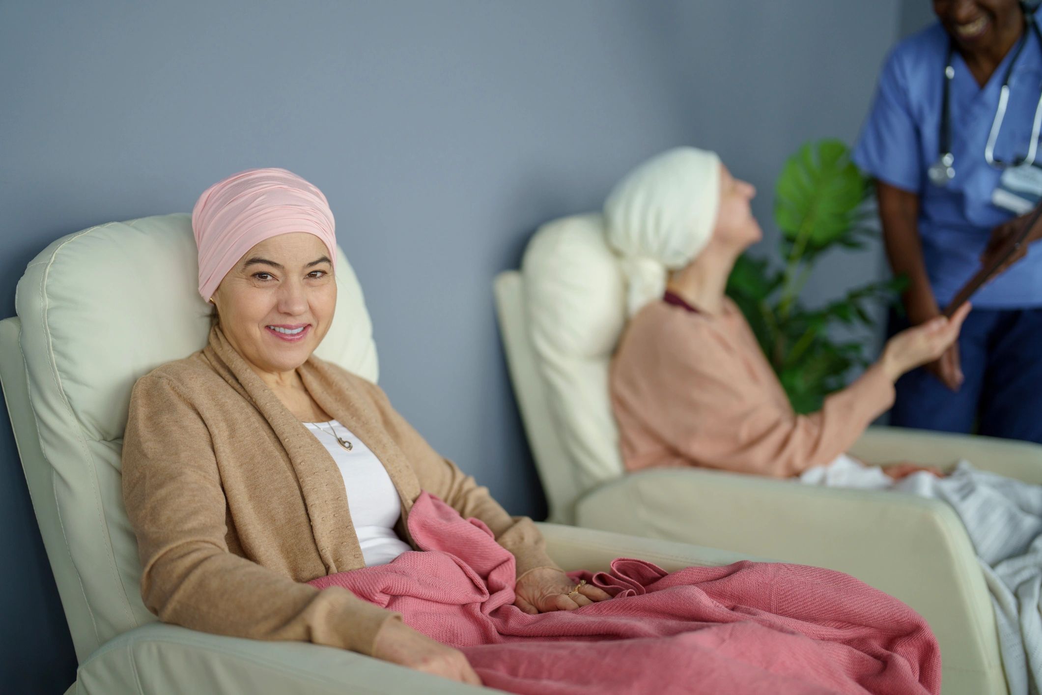 Supportive healthcare staff assisting a patient in a calm clinical setting